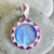 Sterling Silver Blue Fiber Optic Goddess Pendant with Sugilite and Created Pink Opal Inlay